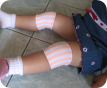 Girls Vertical Stripe Peach Jacquard Wristband on knees