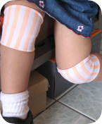 Girls Vertical Stripe Peach Jacquard Wristband on knee