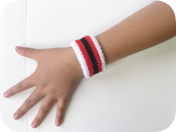 children's striped wrist band on hand